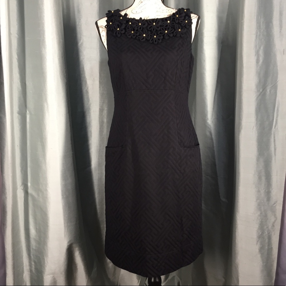 Taylor black sheath dress with rosette collar